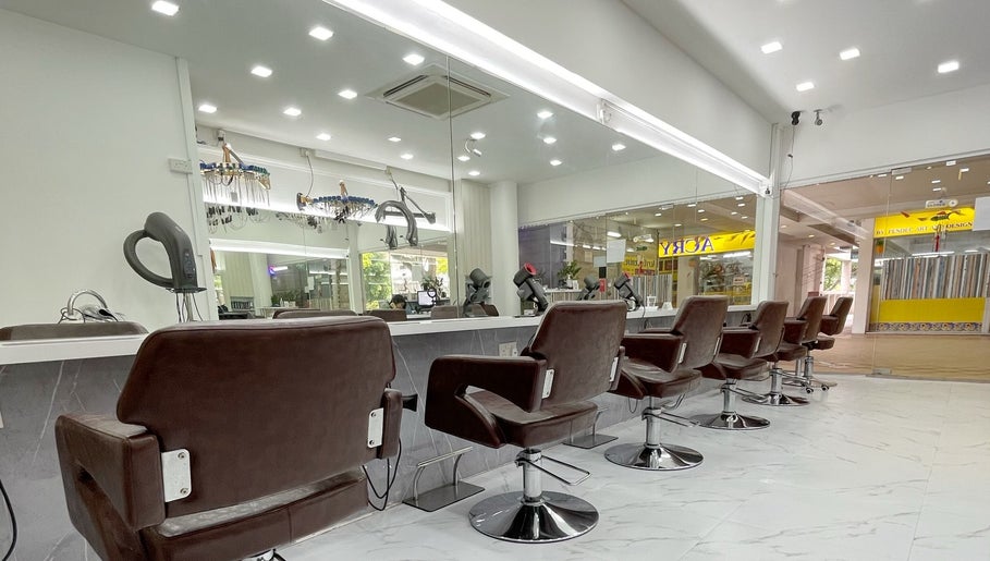 Modern salon interior at HAVA Hair, Complex, SG featuring sleek styling chairs and mirrors.