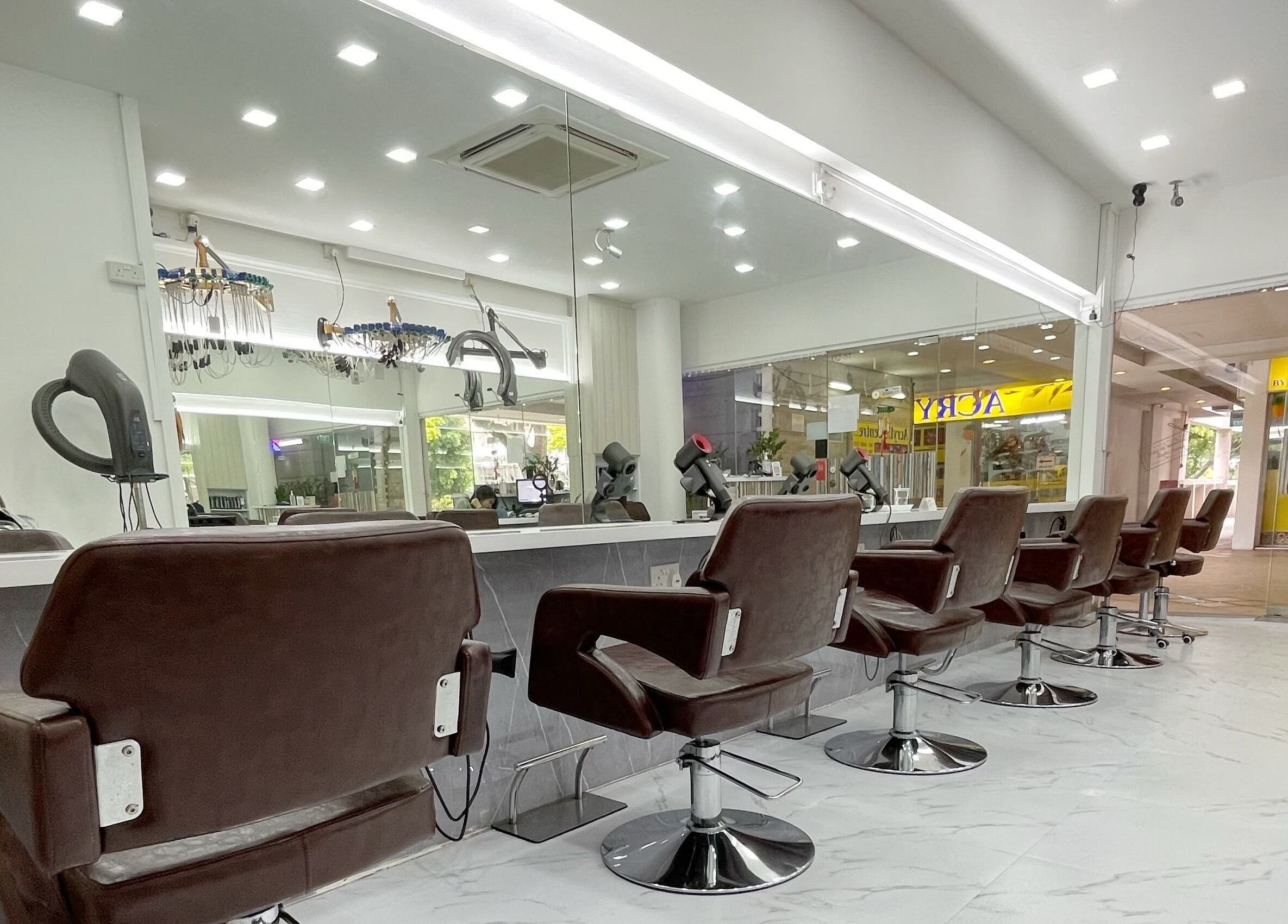 Modern salon interior at HAVA Hair, Complex, SG featuring sleek styling chairs and mirrors.