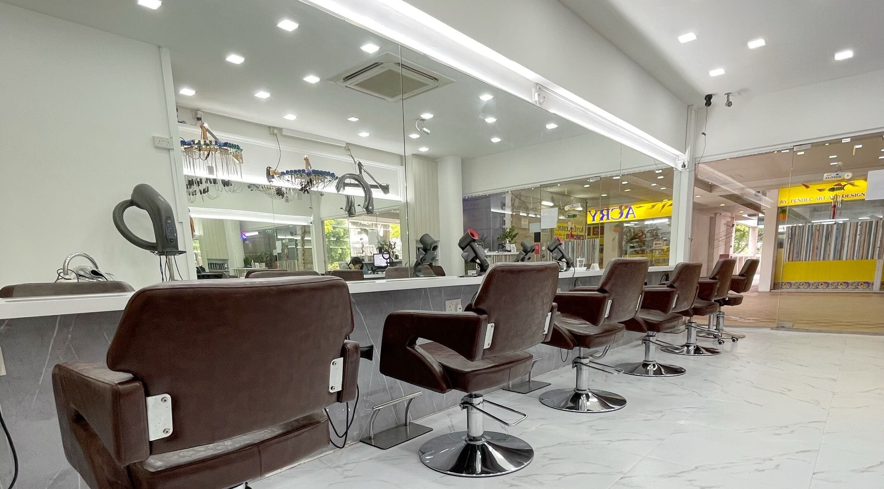 Modern salon interior at HAVA Hair, Complex, SG featuring sleek styling chairs and mirrors.