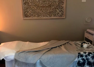 Relaxing massage room at Eco Salon Day Spa in Bermagui, New South Wales, AU, offering serene ambiance.