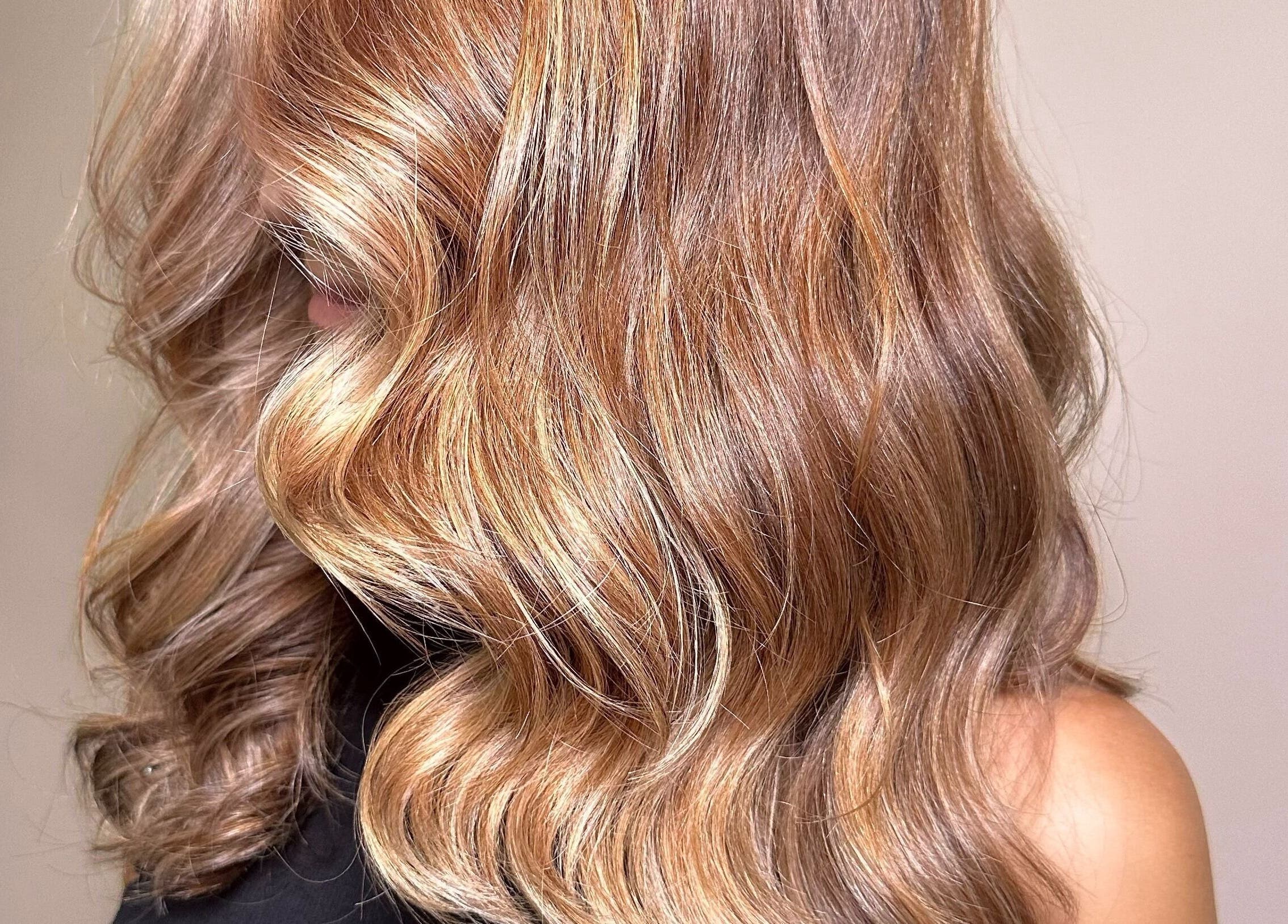 Luxurious golden waves hairstyle at SBI SALON in Englishtown, New Jersey, US, showcasing professional hair color.