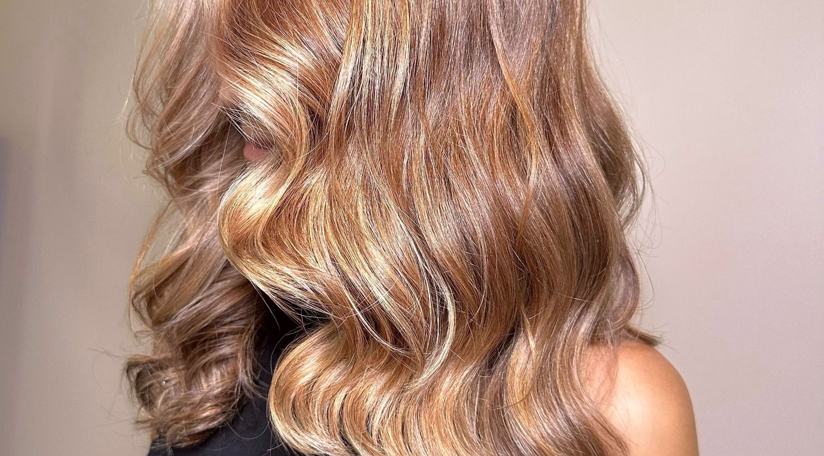 Luxurious golden waves hairstyle at SBI SALON in Englishtown, New Jersey, US, showcasing professional hair color.