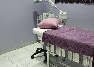Cozy treatment room at Beaunique Beauty Studio Casino in Welkom, Free State, ZA with plush purple decor.