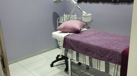 Cozy treatment room at Beaunique Beauty Studio Casino in Welkom, Free State, ZA with plush purple decor.
