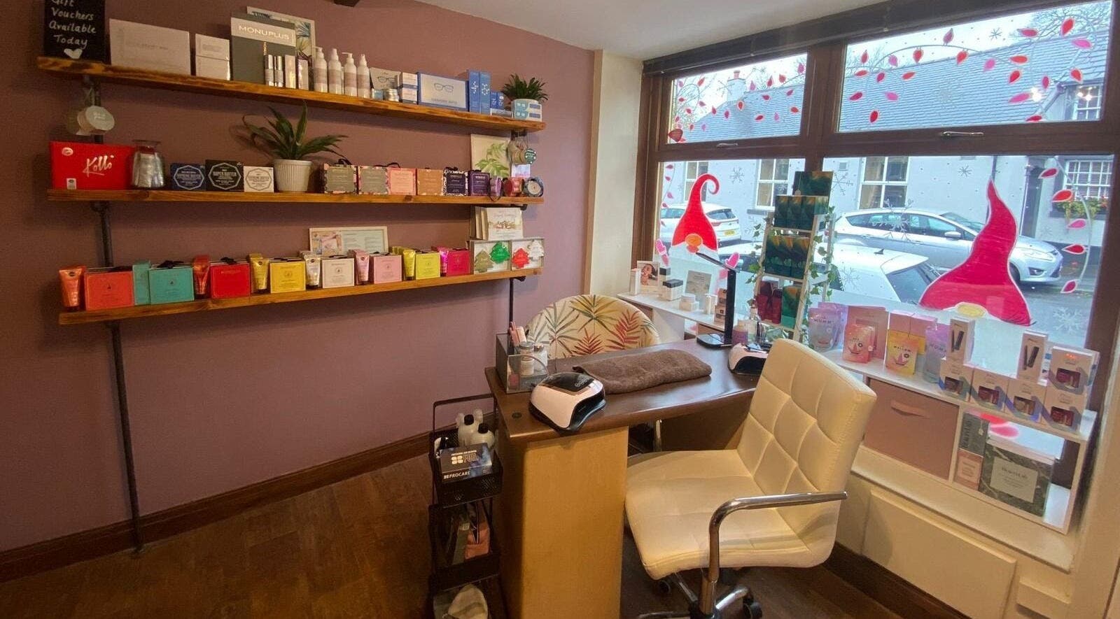 Mad About Beauty salon in Chatburn, England, GB. Shelves with beauty products and welcoming reception area.