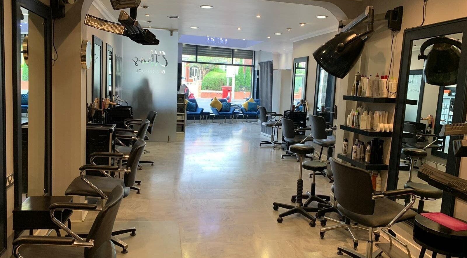 Stylish interior of Ethos Blackpool salon, showcasing chic decor and modern styling chairs in Blackpool, England, GB.