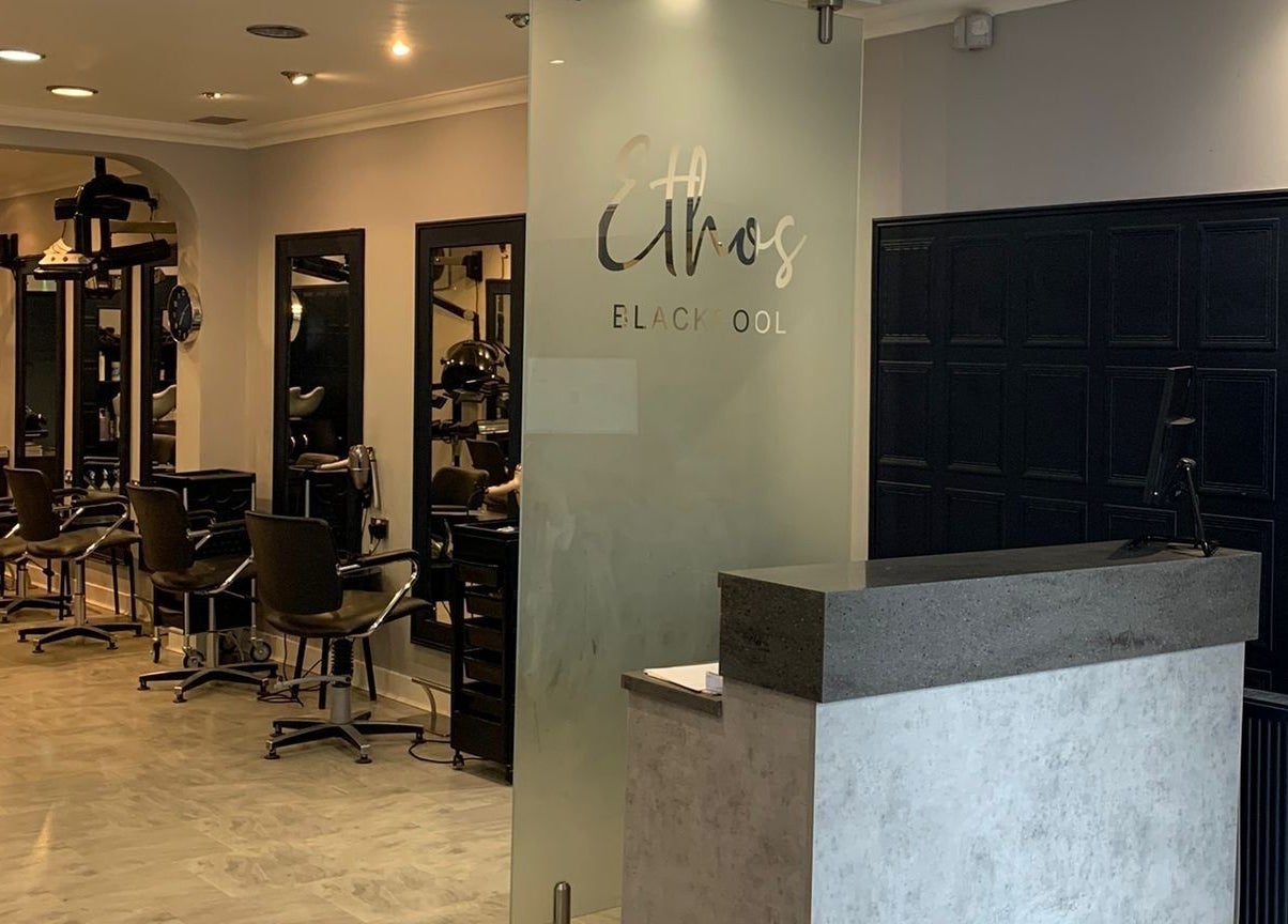 Modern salon interior at Ethos Blackpool, Blackpool, England, GB featuring stylist chairs and mirrors.