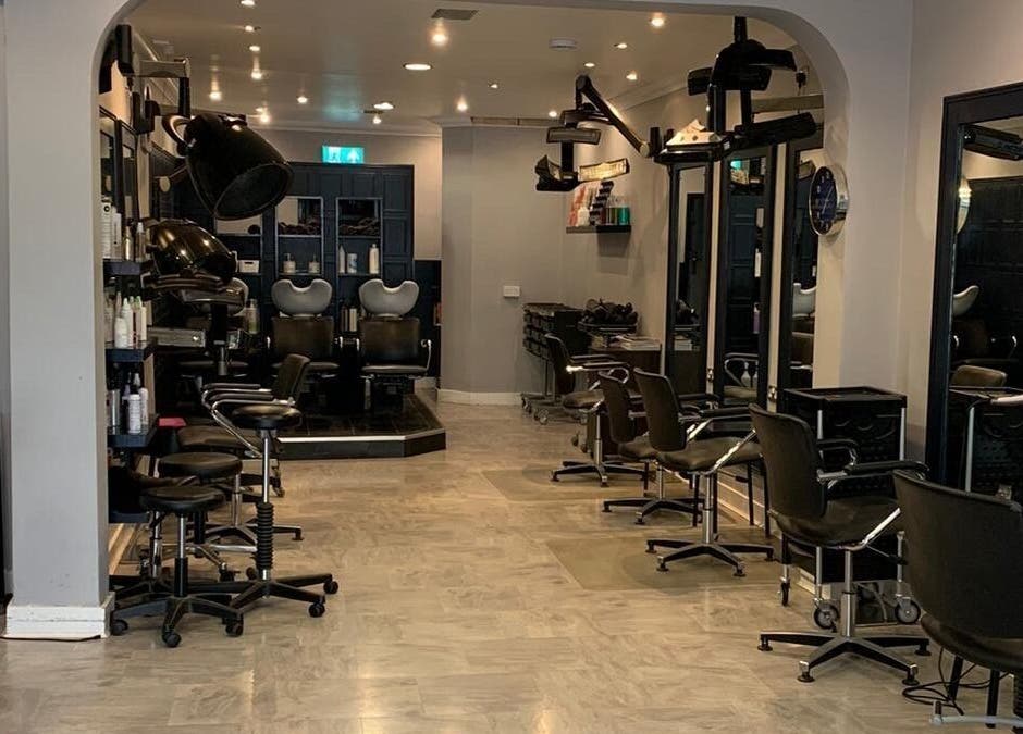 Modern salon interior at Ethos Blackpool, Blackpool, England, GB, showcasing stylish chairs and mirrors.
