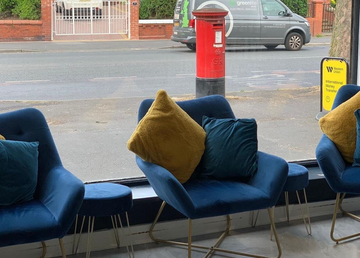 Stylish seating with plush chairs at Ethos Blackpool, Blackpool, England, GB, offering street views.