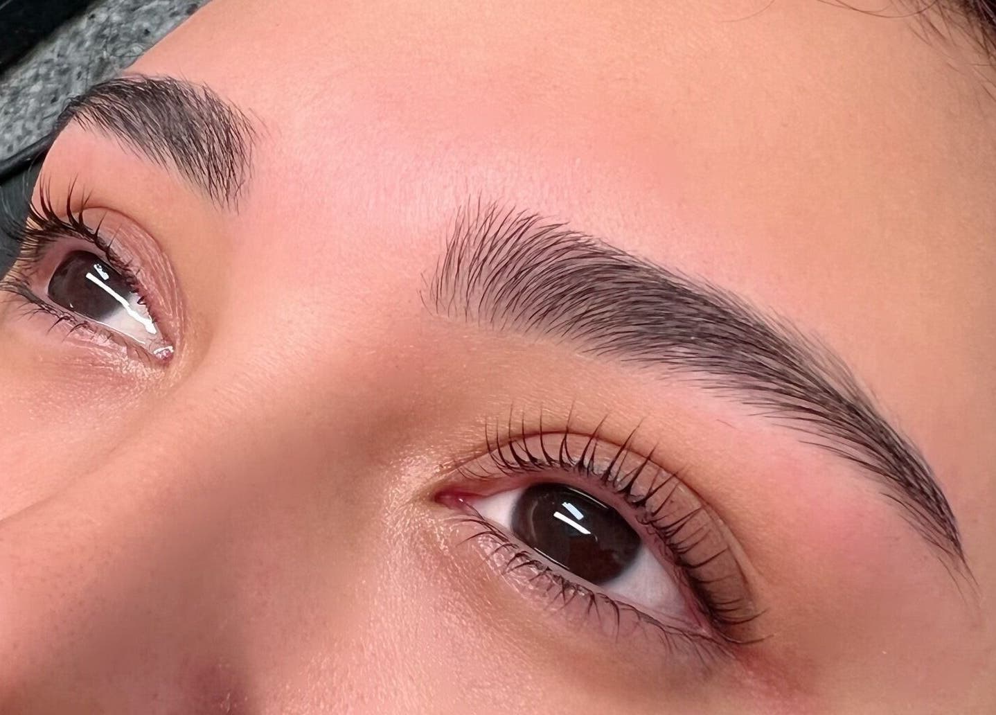 Close-up of expertly shaped brows at Luvvi, Surfers Paradise, Queensland, AU, showcasing beauty precision.