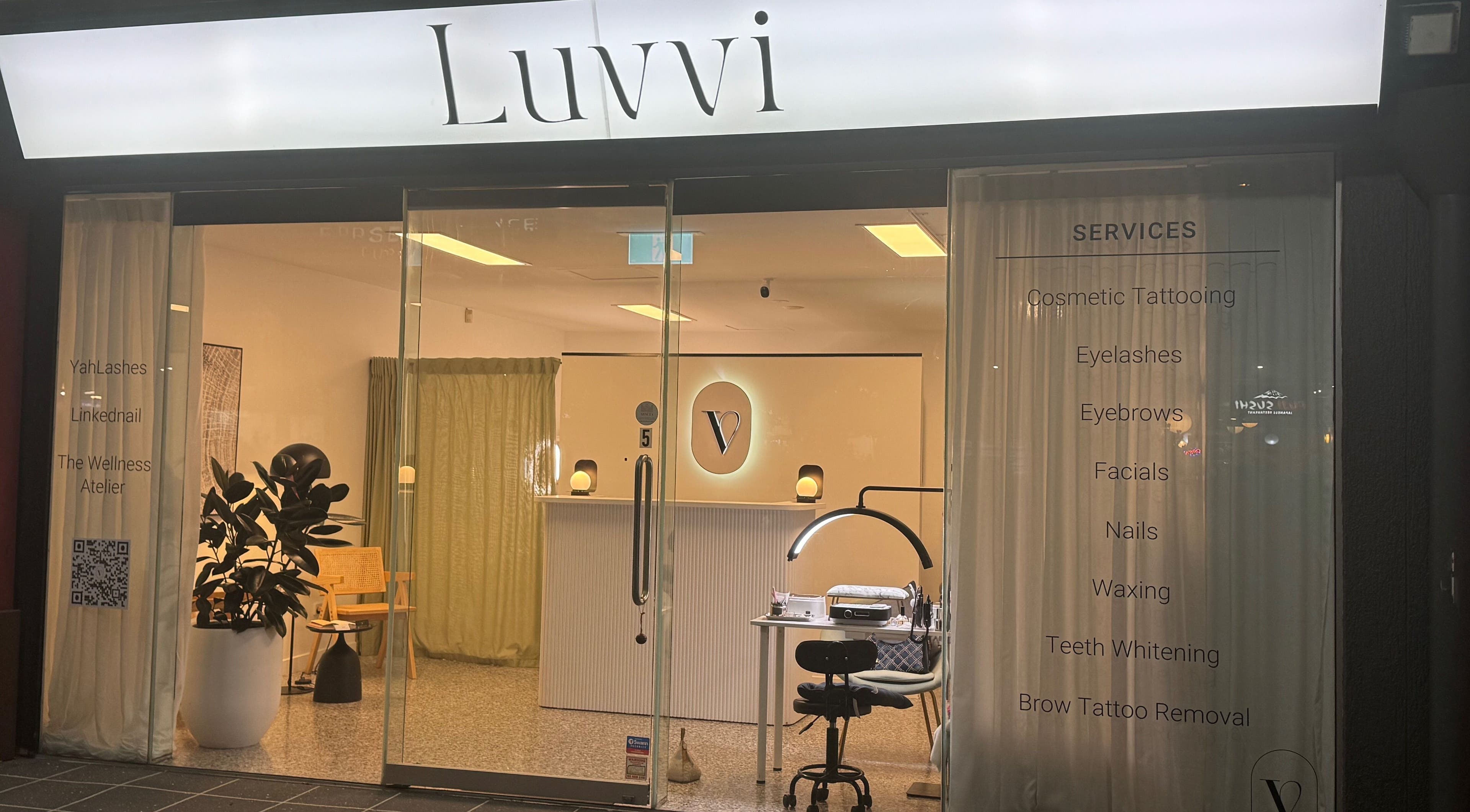 Entrance to Luvvi beauty venue in Surfers Paradise, Queensland, AU, showcasing services and modern decor.