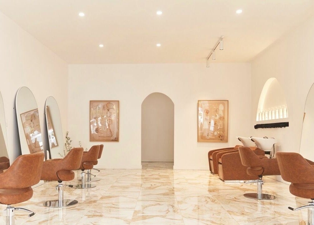 Chic interior of Blondie Bar Salon in Melbourne, Victoria, AU featuring modern chairs and large mirrors.