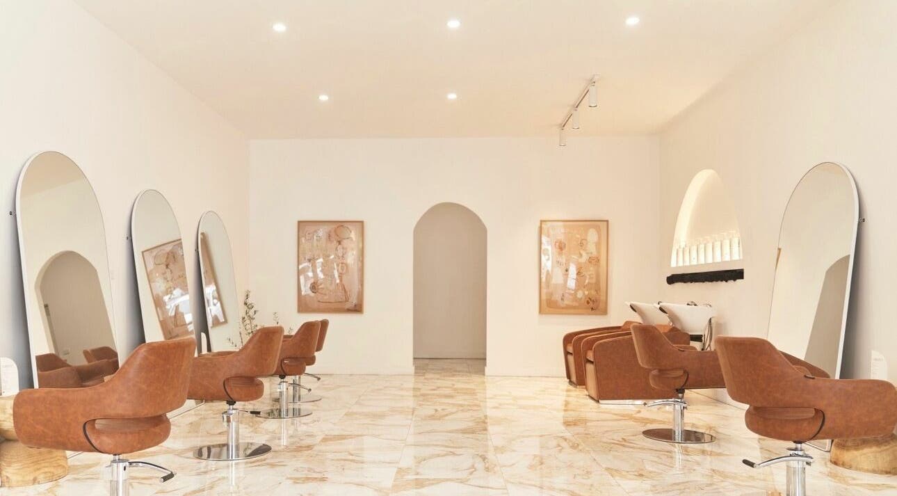 Chic interior of Blondie Bar Salon in Melbourne, Victoria, AU featuring modern chairs and large mirrors.