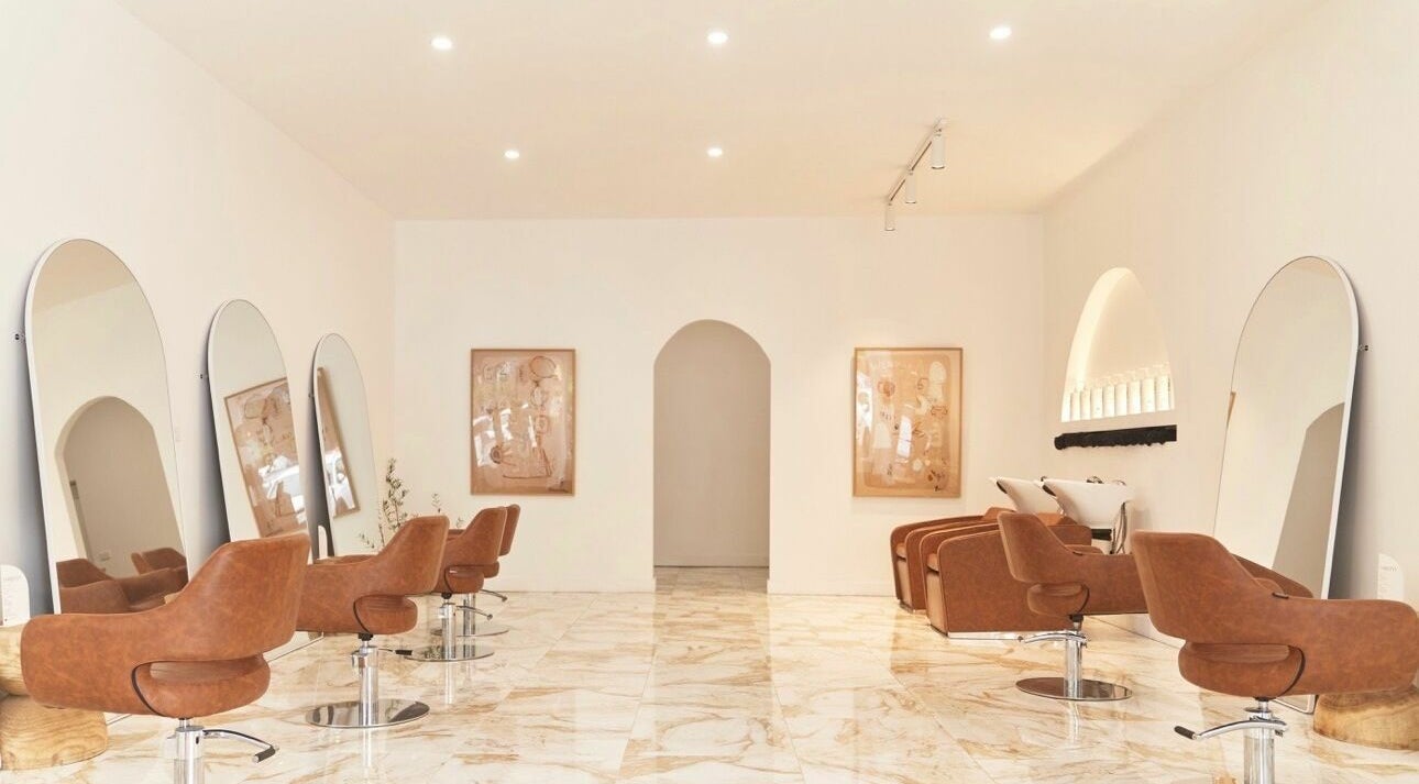 Chic interior of Blondie Bar Salon in Melbourne, Victoria, AU featuring modern chairs and large mirrors.