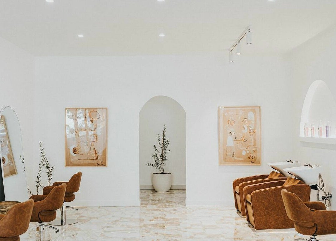 Elegant interior of Blondie Bar Salon in Melbourne, Victoria, AU, featuring stylish chairs and modern decor.