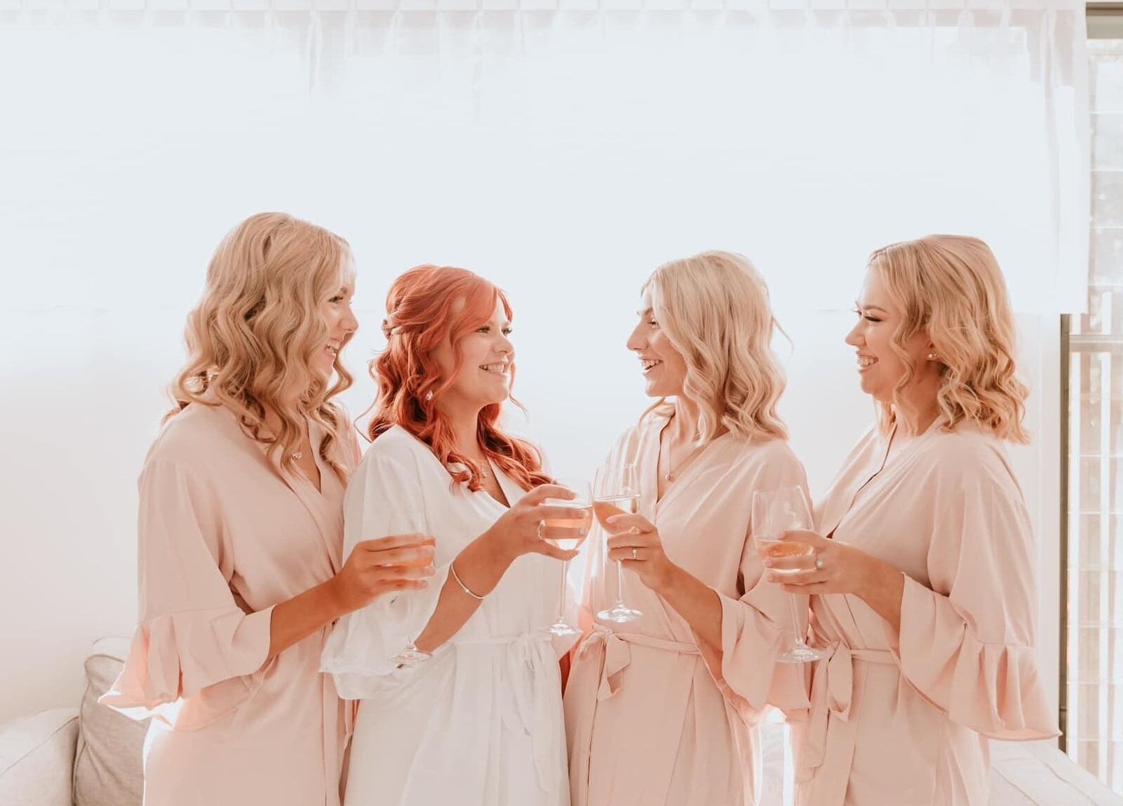 Bridal party celebrating at Tahnee Anderson MUA, Redbank Plains, Queensland, AU. Stylish hair and makeup in focus.