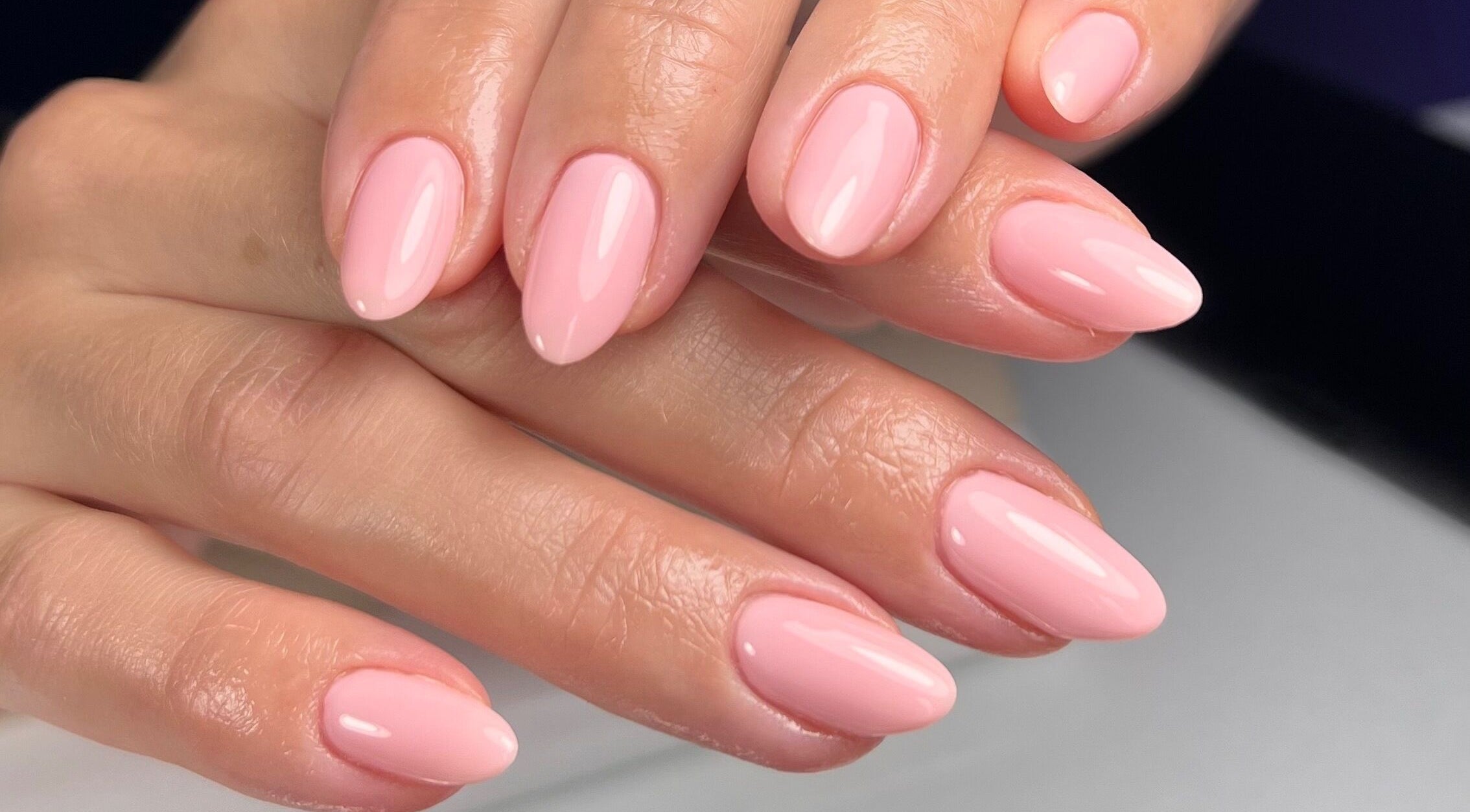 Elegant pink manicured nails at Solara Beauty, Toronto, Ontario, CA. Perfect for a stylish look.