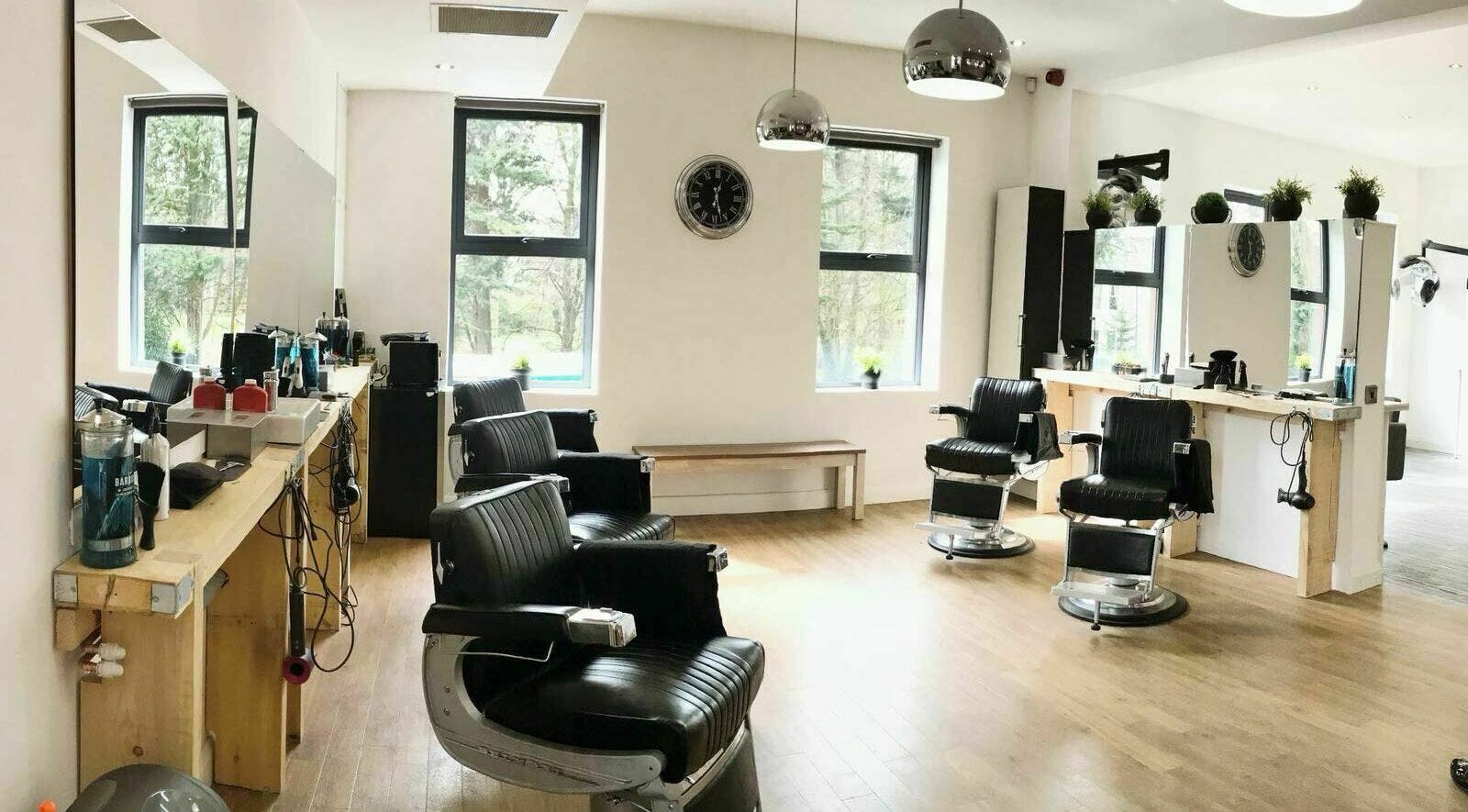 Modern salon interior with sleek chairs at Agency Hair, Belfast, Northern Ireland, GB.