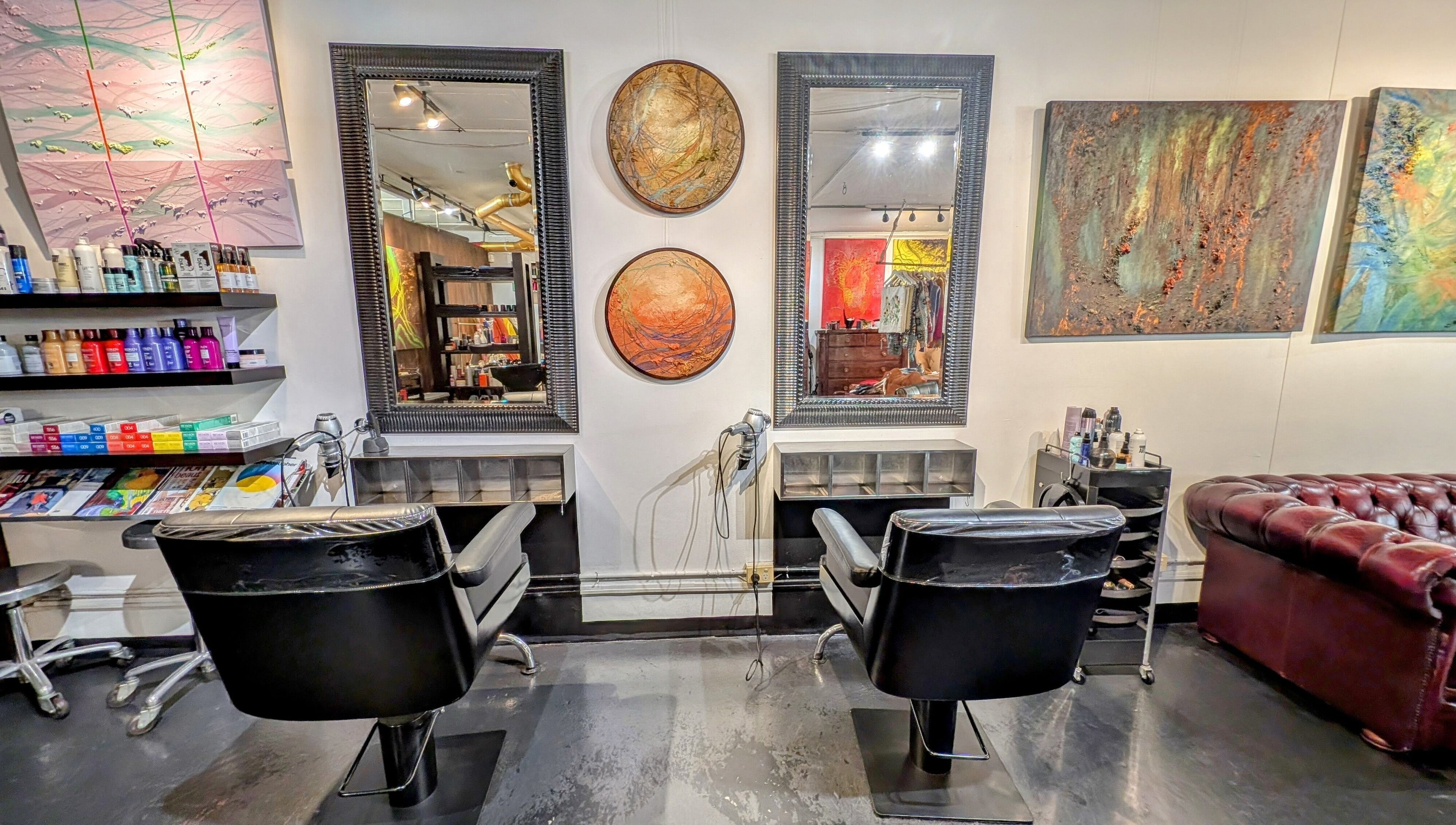 Elegant salon station at Ambo Ars in Newtown, New South Wales, AU, featuring art and luxury seating.