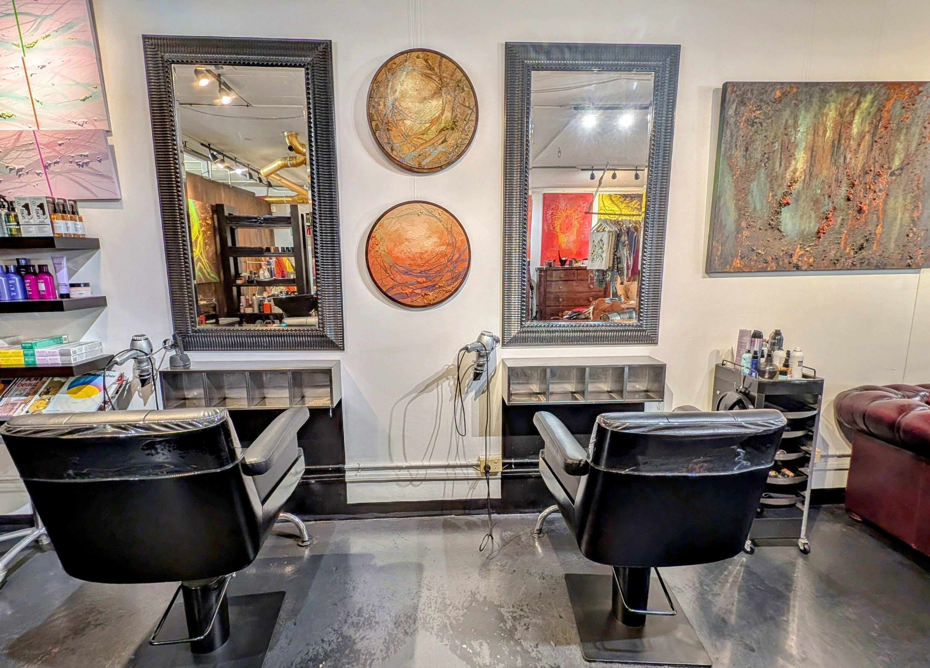 Elegant salon station at Ambo Ars in Newtown, New South Wales, AU, featuring art and luxury seating.