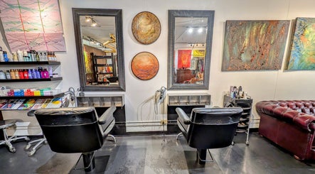 Elegant salon station at Ambo Ars in Newtown, New South Wales, AU, featuring art and luxury seating.