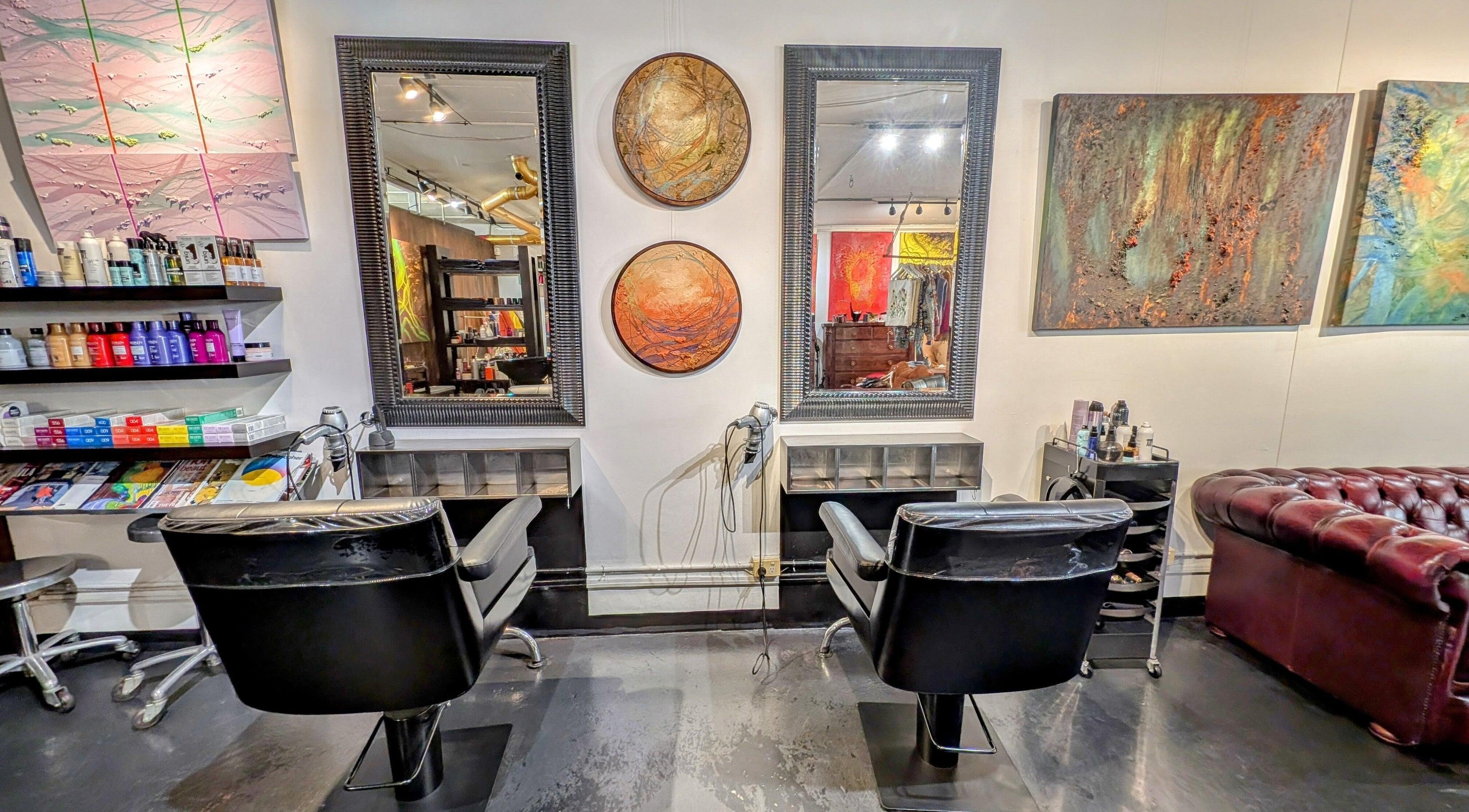 Elegant salon station at Ambo Ars in Newtown, New South Wales, AU, featuring art and luxury seating.