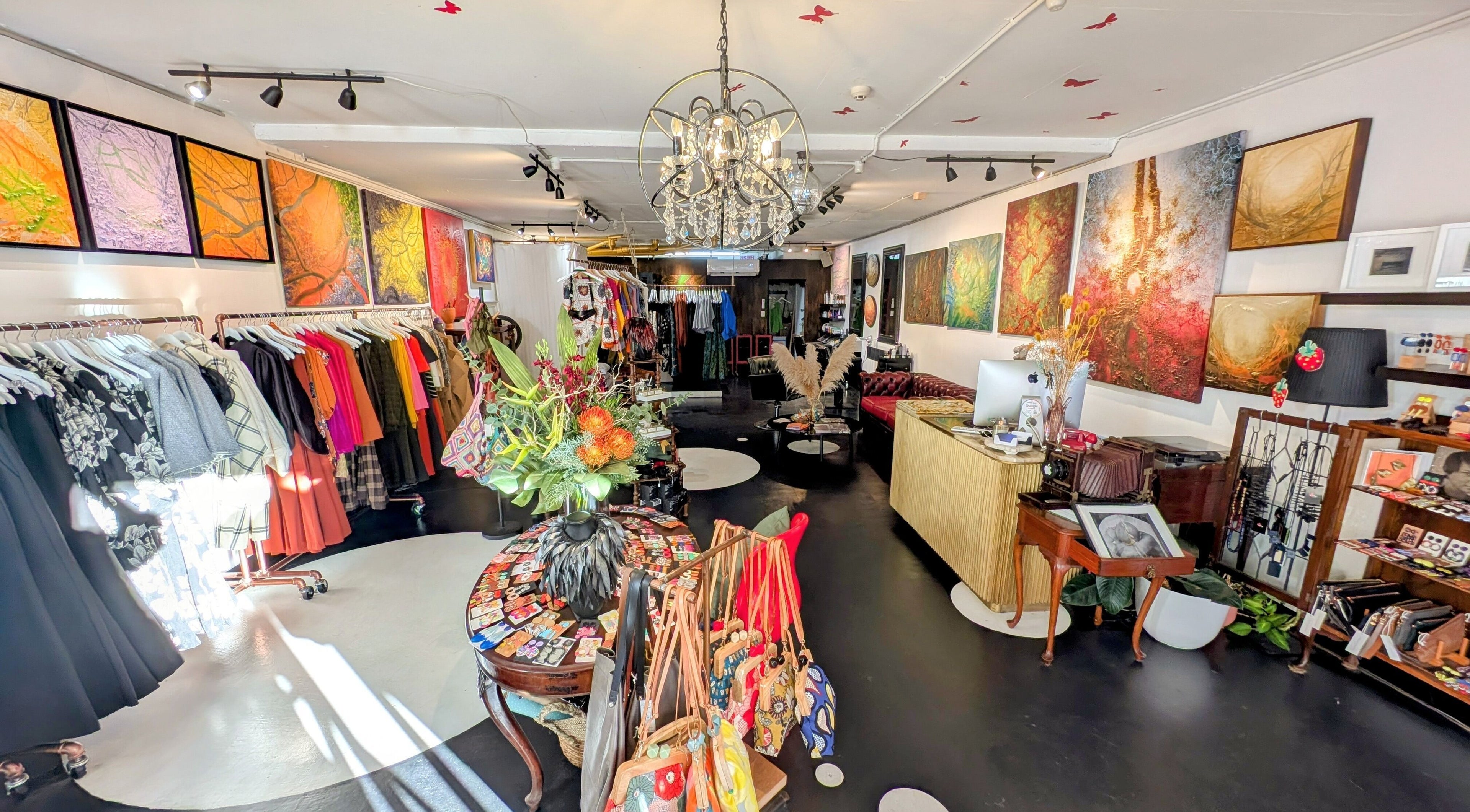 Explore vibrant fashion and decor at Ambo Ars, Newtown, New South Wales, AU, featuring colorful garments and art.