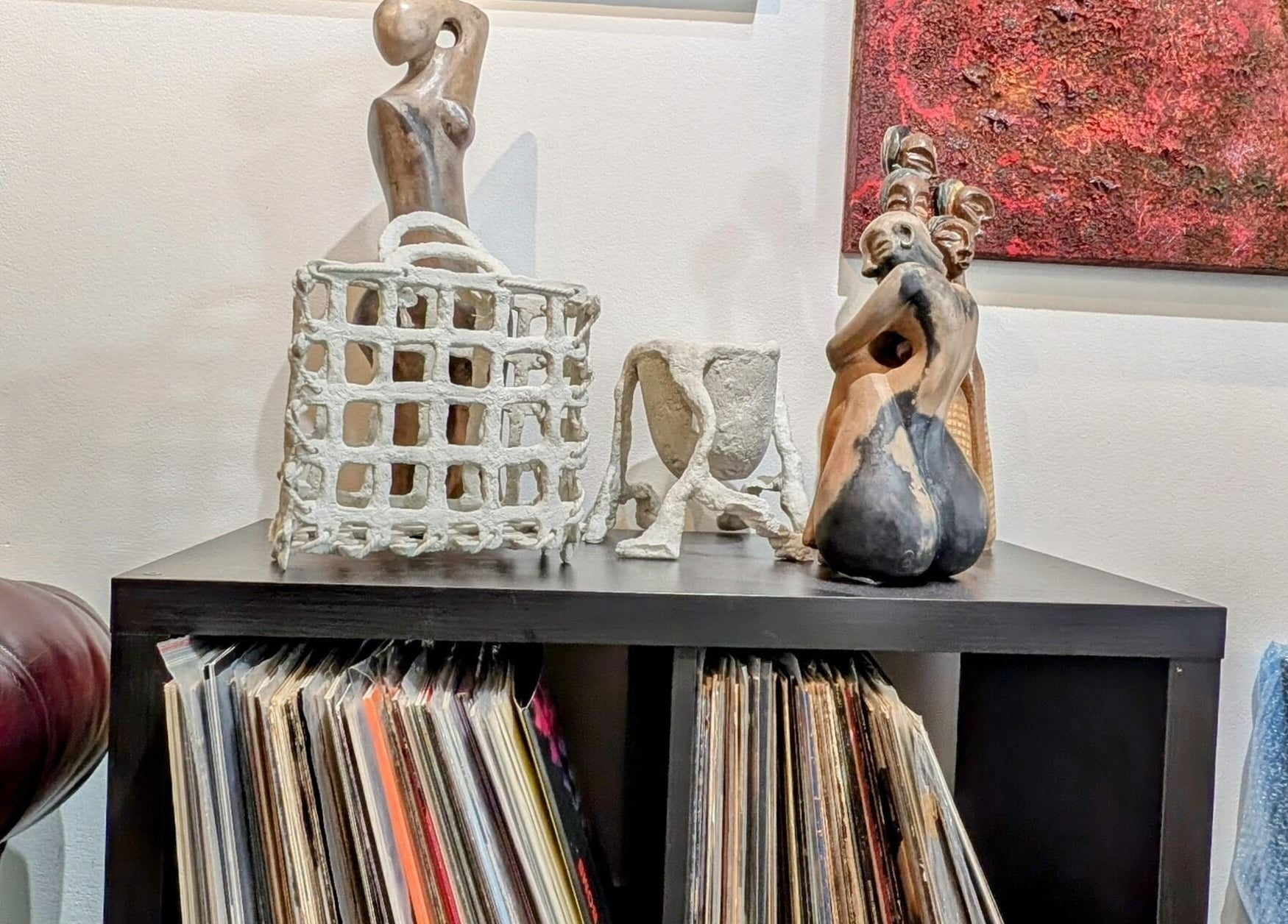 Unique sculptures on a shelf at Ambo Ars, Newtown, New South Wales, AU, showcasing artistic elegance.