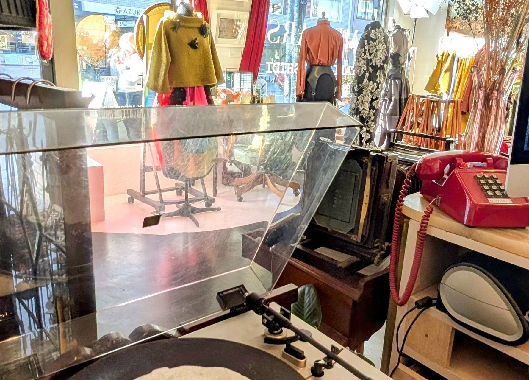 Ambo Ars in Newtown, New South Wales, AU featuring vintage decor, fashions, and a retro red phone.