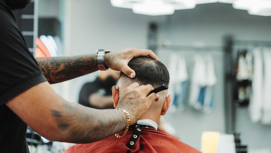 Frankston Barbers in Melbourne, Victoria, AU showcases a precise haircutting technique on a client.