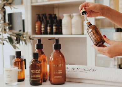 Ener-Chi Penarth, Penarth, Wales, GB. Essential oils on display with hand holding dropper.