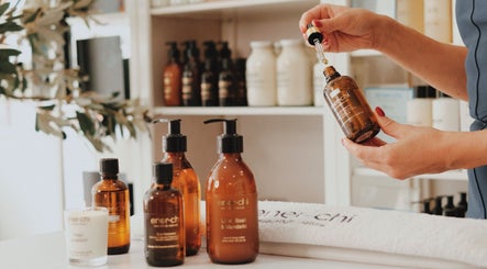 Ener-Chi Penarth, Penarth, Wales, GB. Essential oils on display with hand holding dropper.