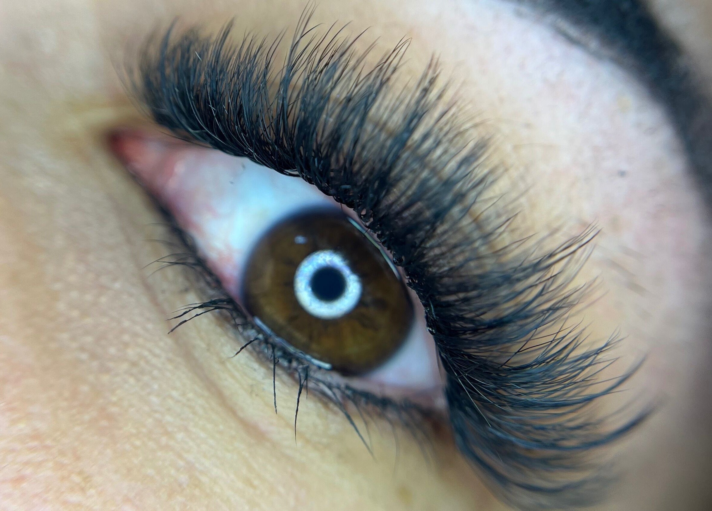 Close-up of lush eyelashes at Leigh Mac in Opelika, Alabama, US, showcasing beauty services.