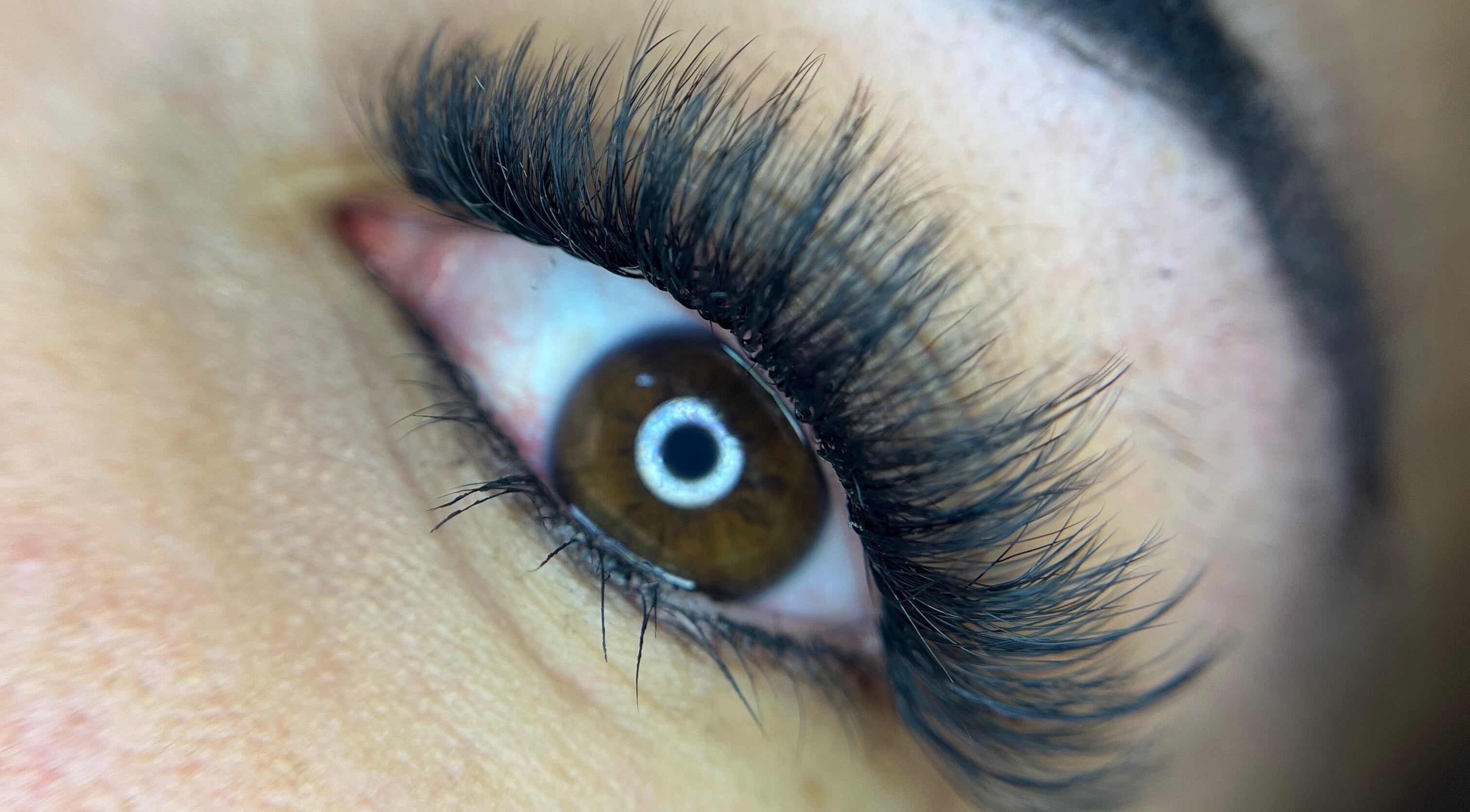 Close-up of lush eyelashes at Leigh Mac in Opelika, Alabama, US, showcasing beauty services.
