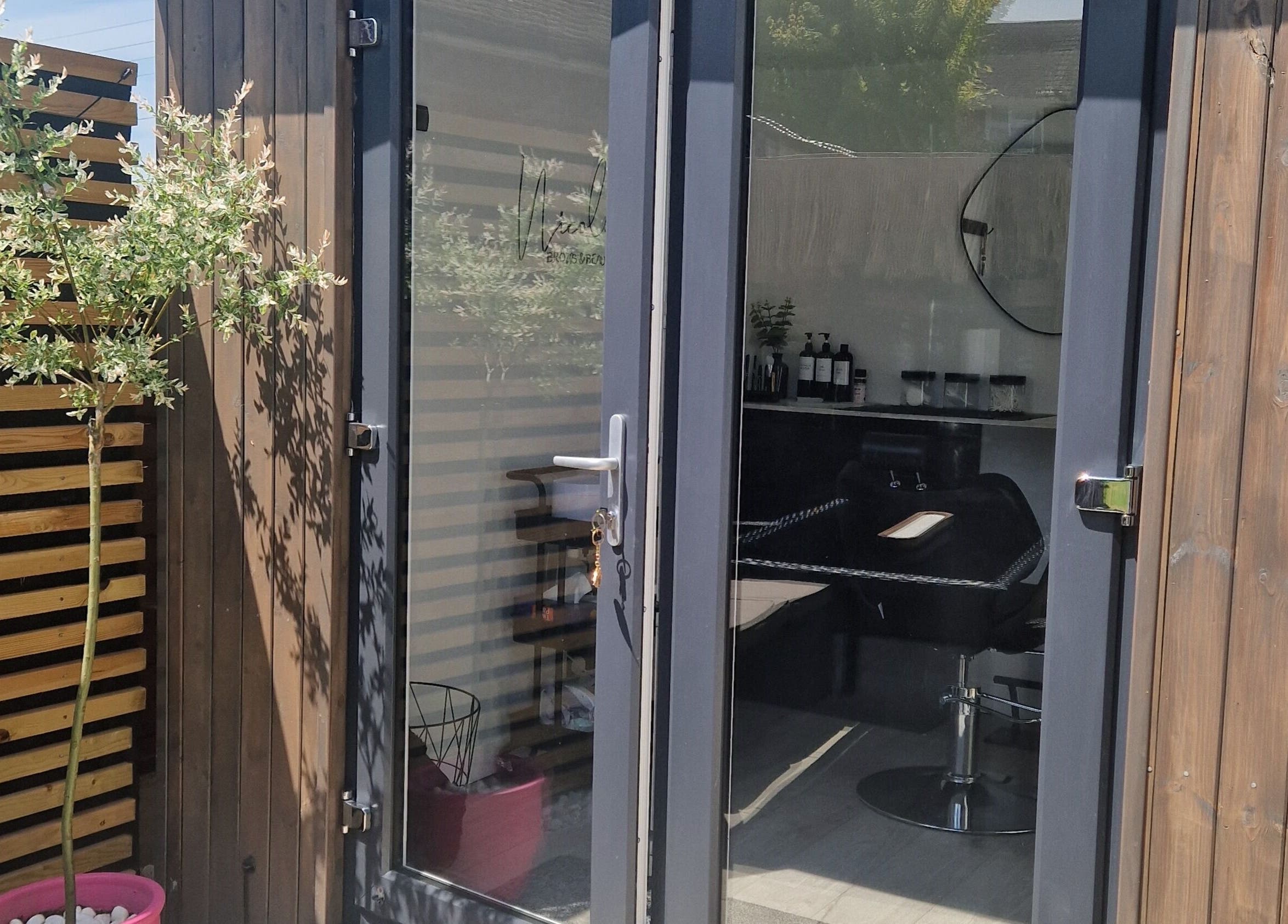 Entrance of Nicole's Brows and Beauty in Sheerness, England, showcasing a modern, inviting salon design.