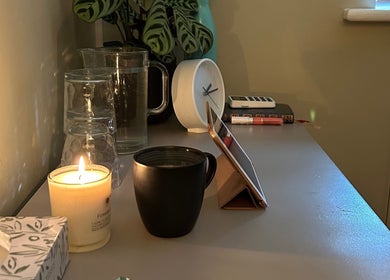A cozy wellness corner at Alex Hammond Knowles in Berkhamsted, England, GB with candle and clock.