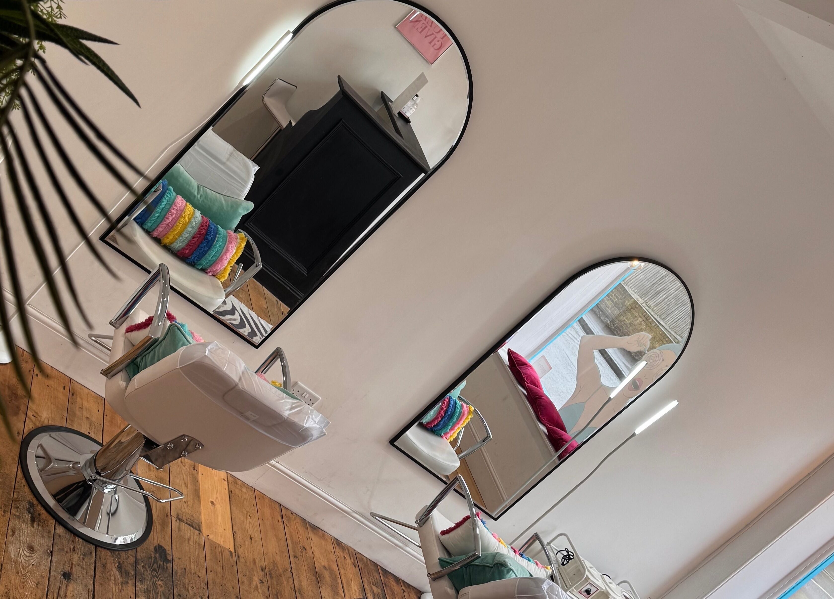 Stylish interior at Get Waxed, featuring chic mirrors and vibrant decor, Gloucester, England, GB.
