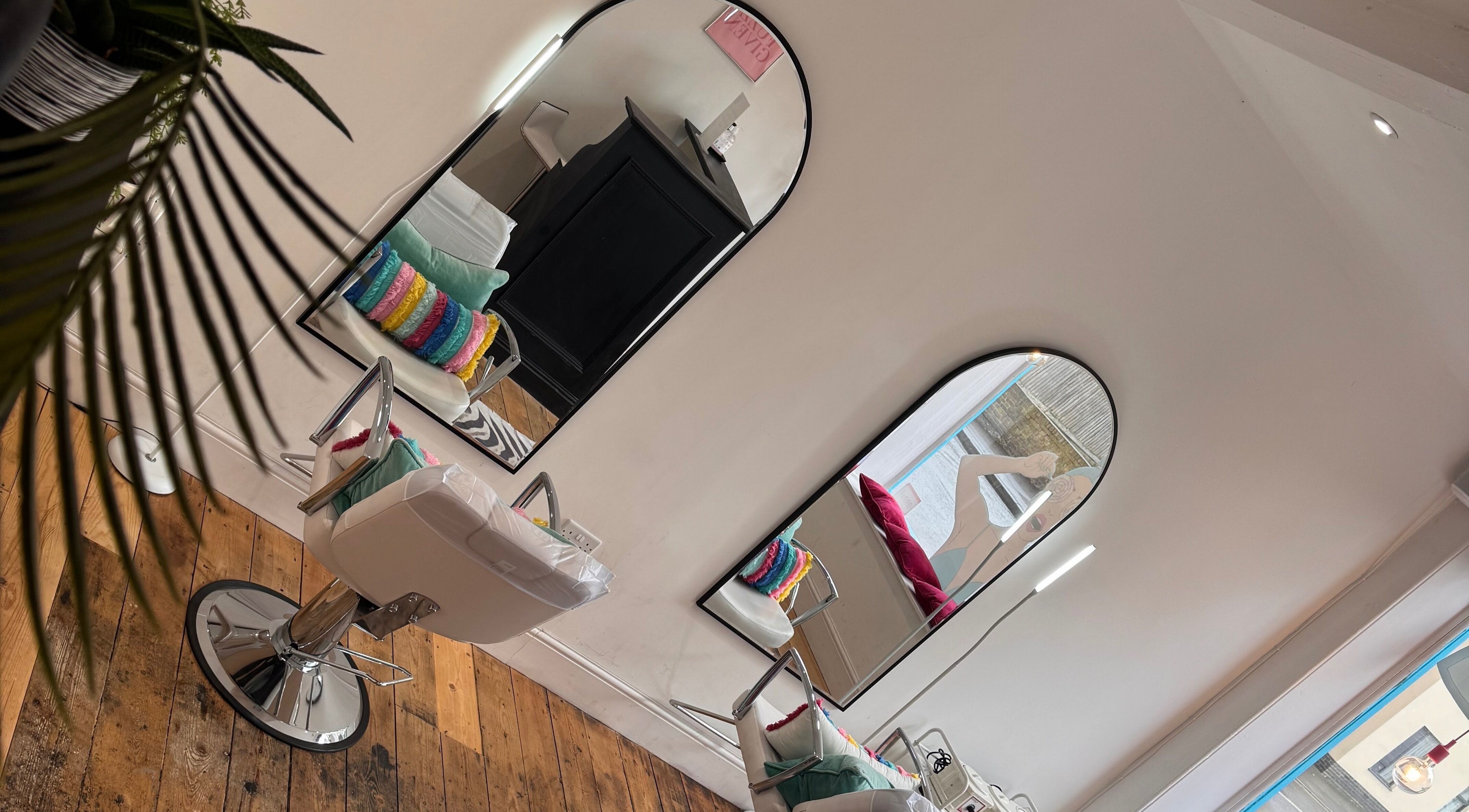Stylish interior at Get Waxed, featuring chic mirrors and vibrant decor, Gloucester, England, GB.