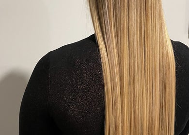 Long, sleek blonde hair styled at ONYX SALON in Miami Beach, Florida, US.