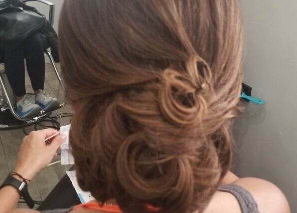 Elegant updo hairstyle at ONYX SALON, Miami Beach, Florida, US, showcasing professional styling.