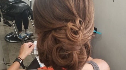 Elegant updo hairstyle at ONYX SALON, Miami Beach, Florida, US, showcasing professional styling.