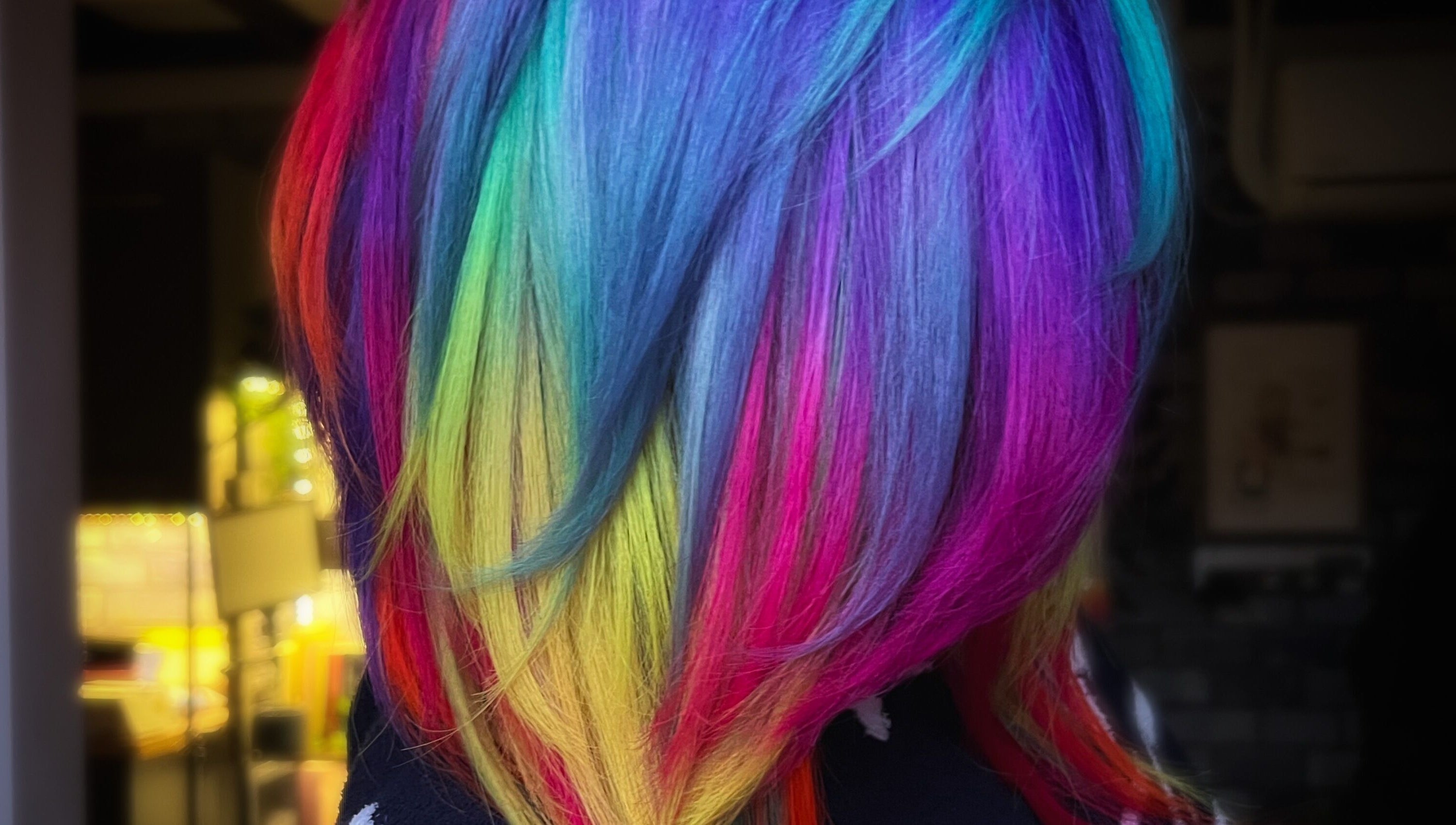 Rainbow-colored hair styled at Colouring On The Spectrum in Inverness, Scotland, GB.