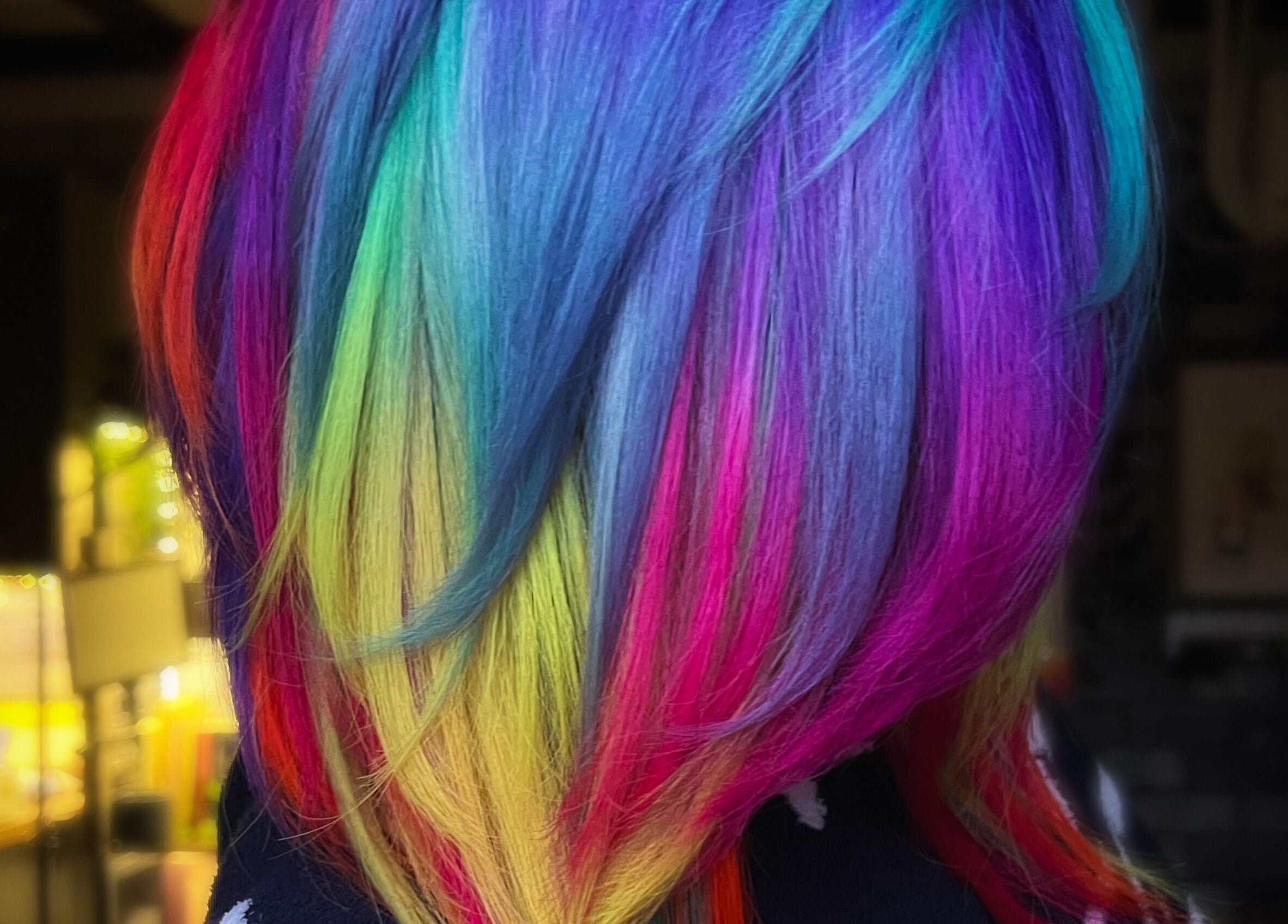 Rainbow-colored hair styled at Colouring On The Spectrum in Inverness, Scotland, GB.