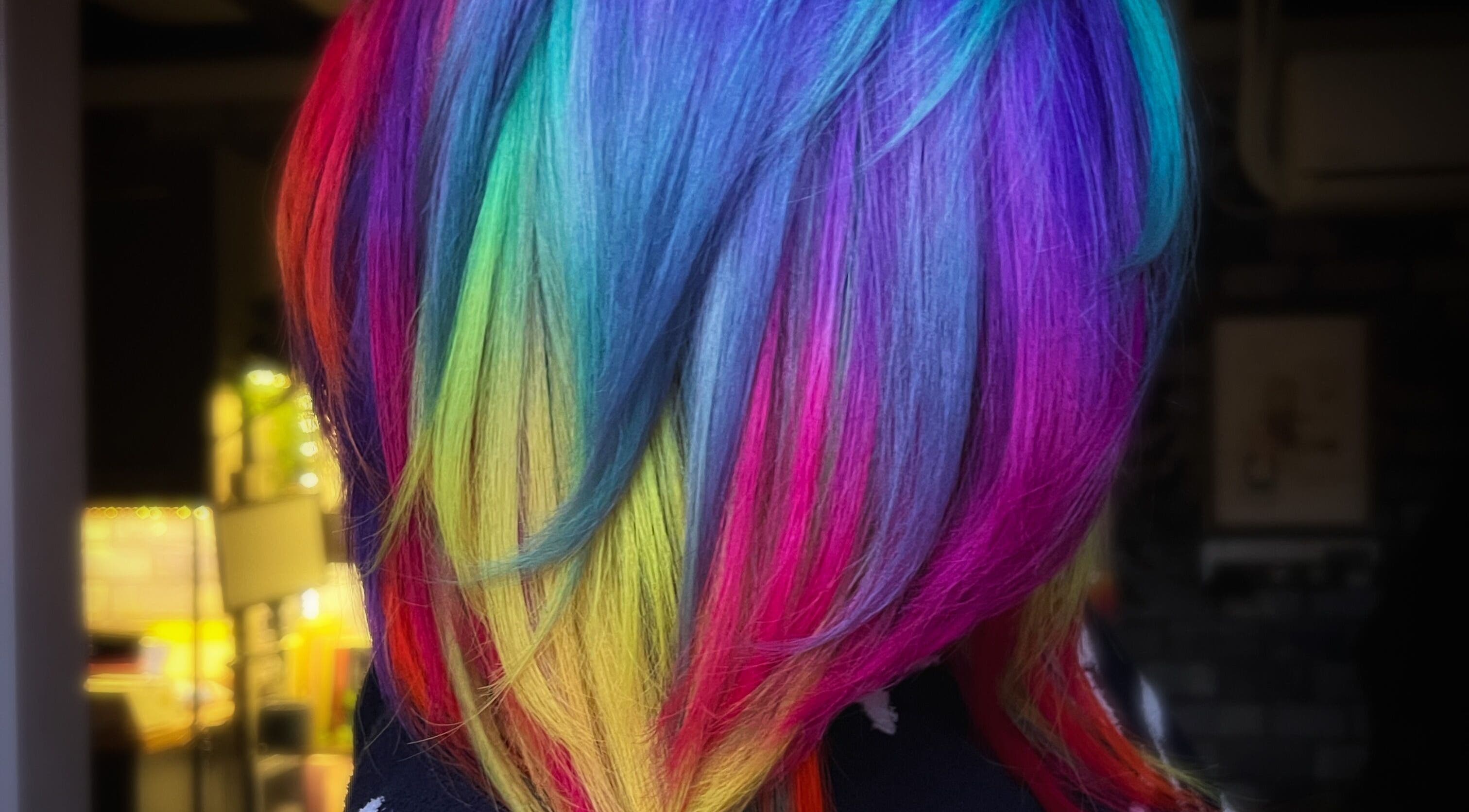 Rainbow-colored hair styled at Colouring On The Spectrum in Inverness, Scotland, GB.