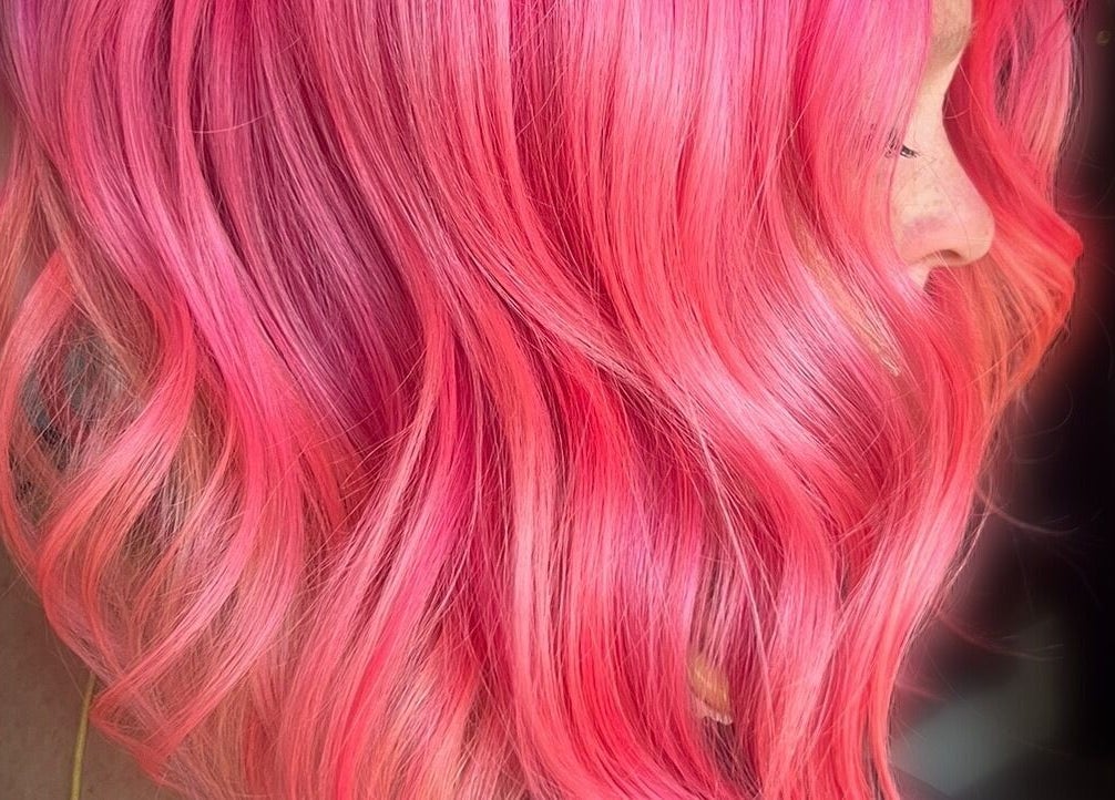 Vibrant pink hair with waves at Colouring On The Spectrum, Inverness, Scotland, GB.