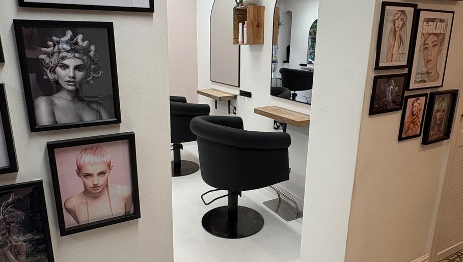 Stylish interior of Shelley Lane Salon in Aberkenfig, Wales, GB with framed artwork and cozy styling chairs.