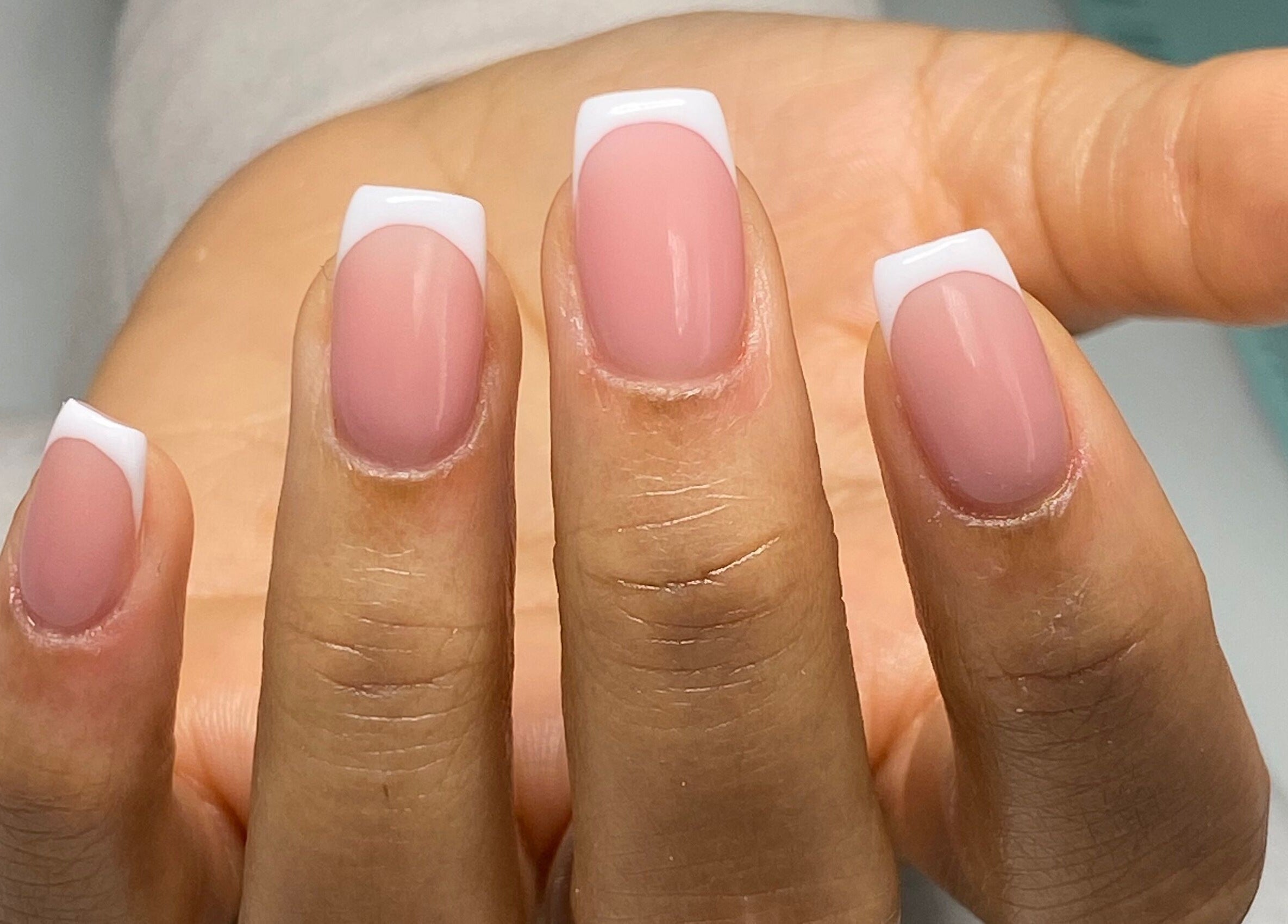 Manicured nails with French tips at Nail Salon Qualitatif, Port Elizabeth, Eastern Cape, ZA.
