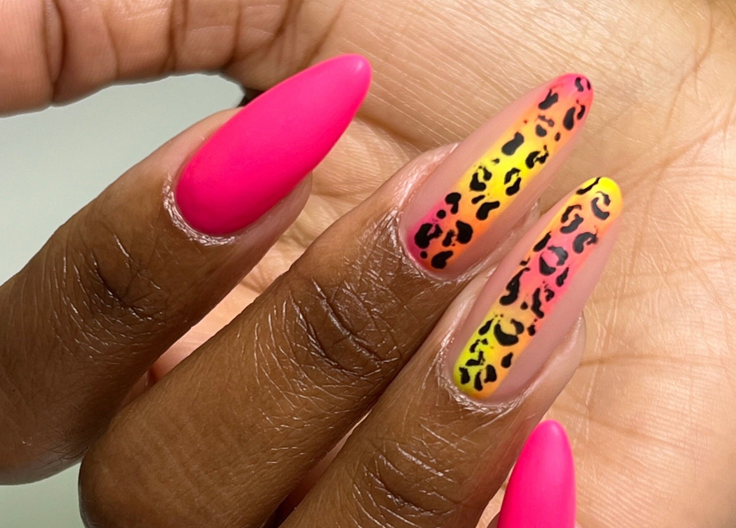 Bright pink and leopard print nails at Nail Salon Qualitatif, Port Elizabeth, Eastern Cape, ZA.