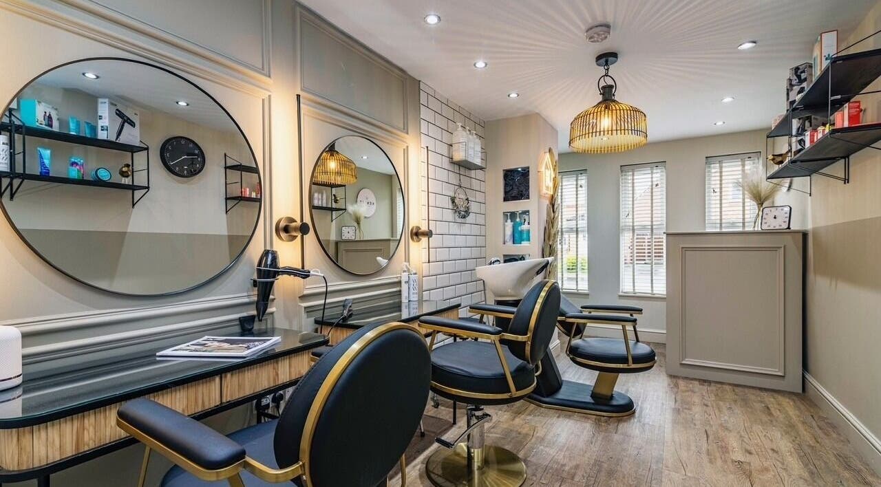 Interior of Kenlee Taylor Hair in Langley Mill, England, showcasing stylish salon chairs and mirrors.
