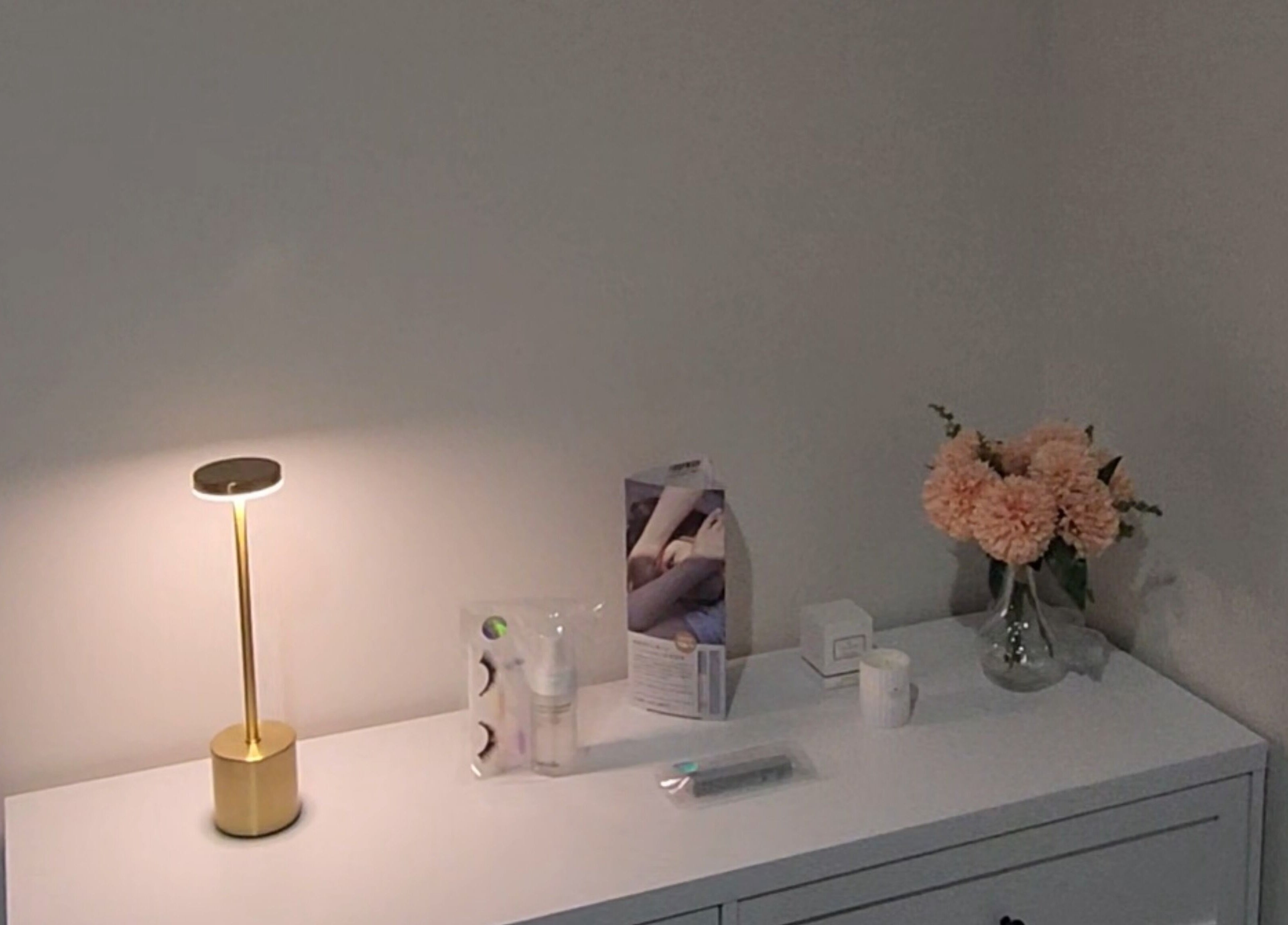 Chic dresser with flowers and products at Lashes by Megumi - Point Cook, Point Cook, Victoria, AU.